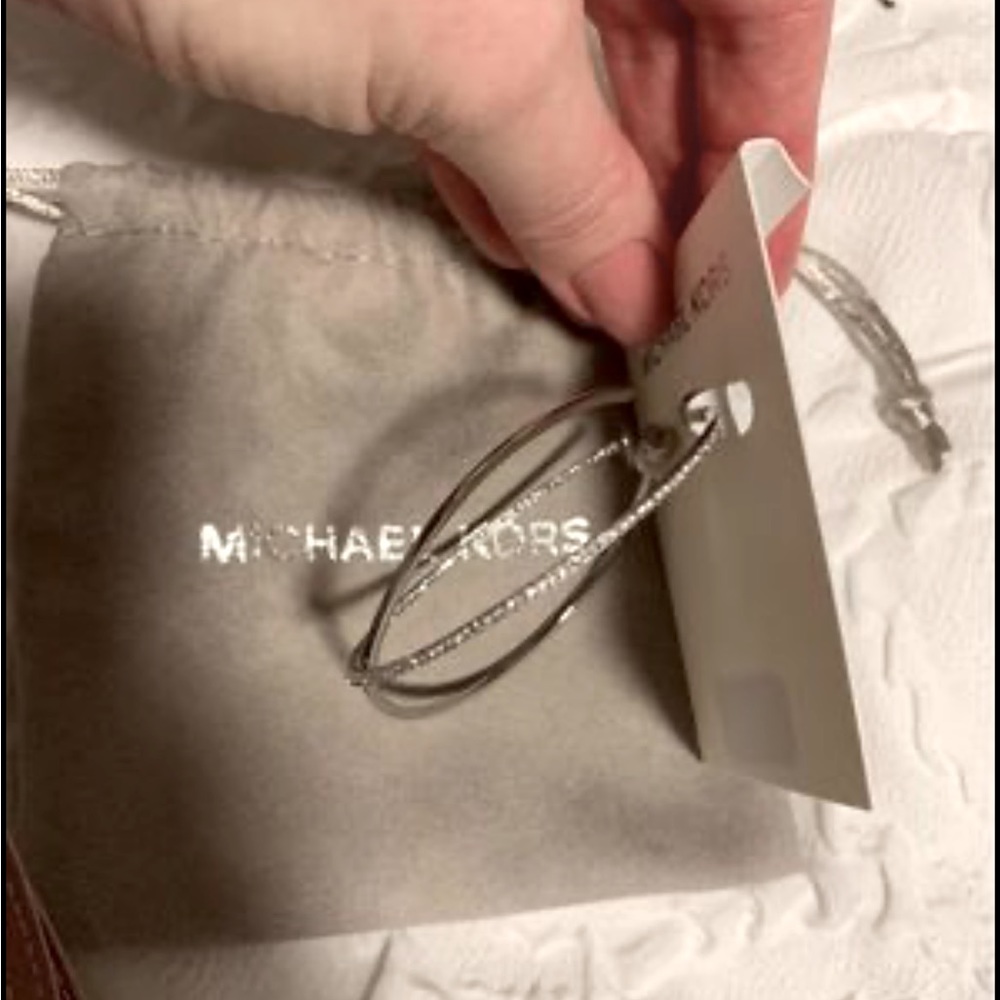 New Michael Kors hoop earrings with storage bag.  Original price was $125 p/t